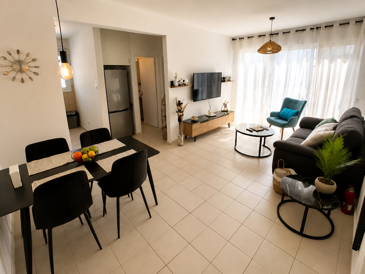 Bright open-plan living and dining room at Pervolia 206 Apartment in Paphos